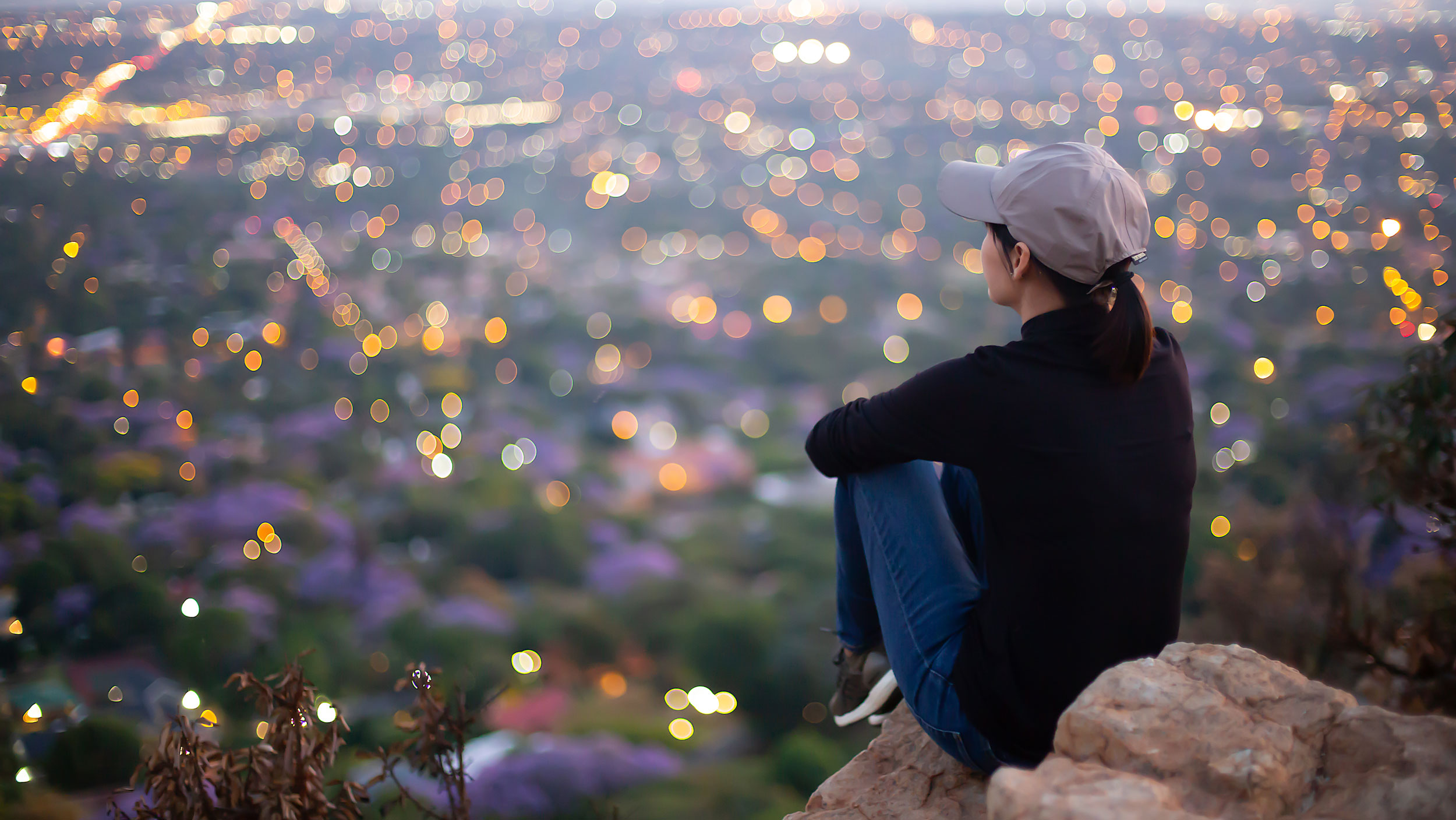 Asian_Woman_on_Cliff_Overlooking_City Asian_Woman_on_Cliff_Overlooking_City