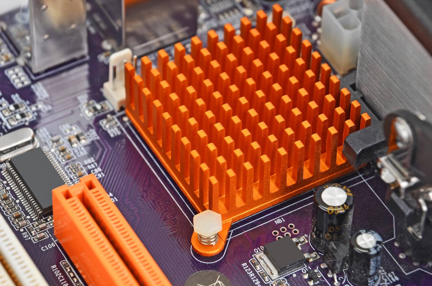 Orange_Printed_Computer_Motherboard_Closeup