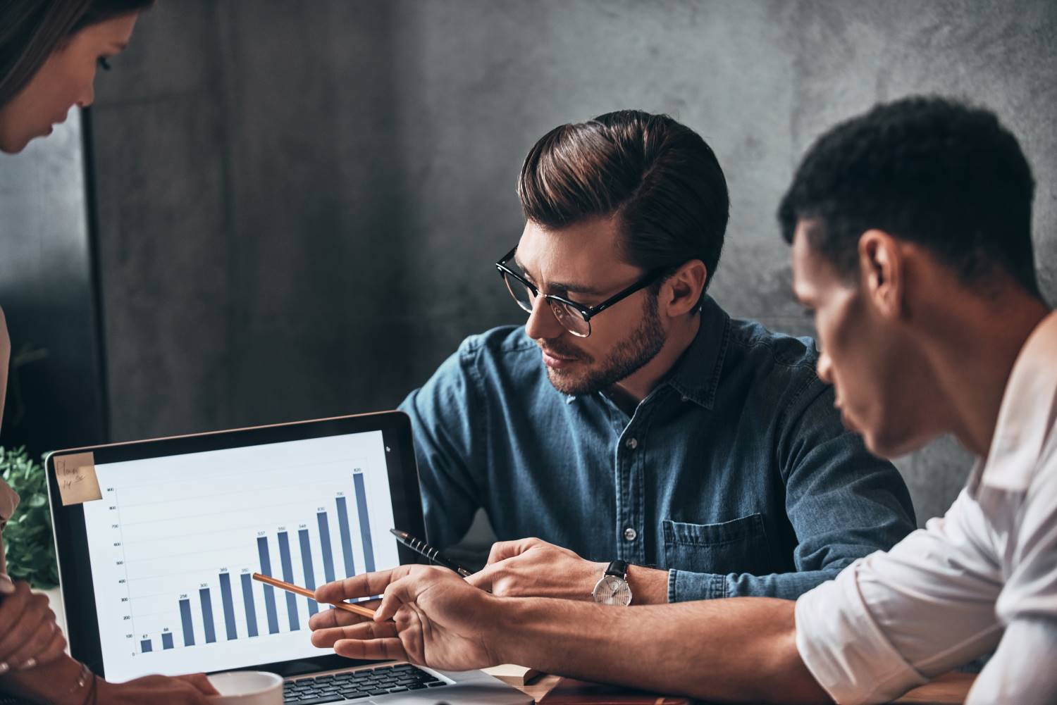 Young business people analyzing sales