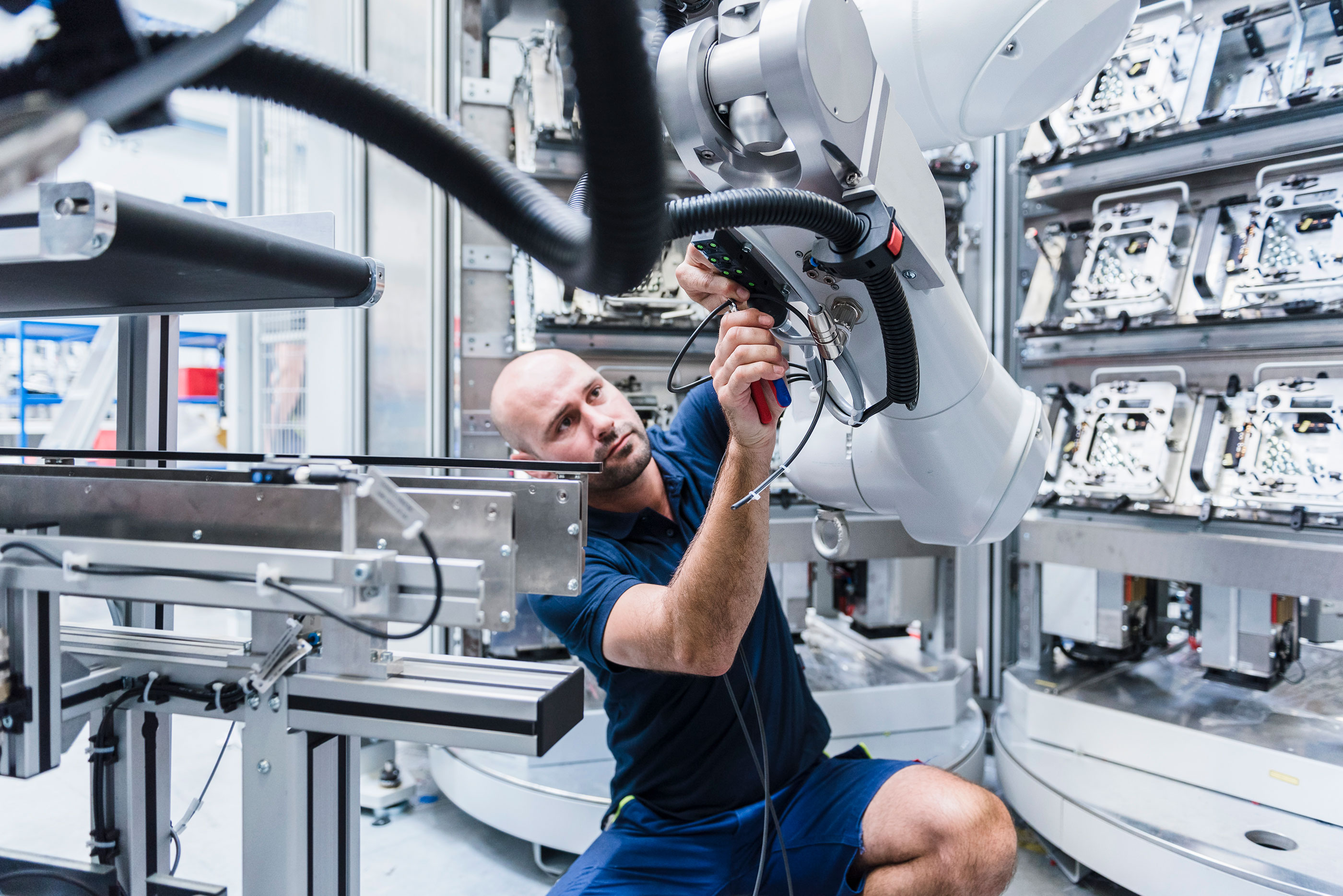 Man_Working_on_Industrial_Robot