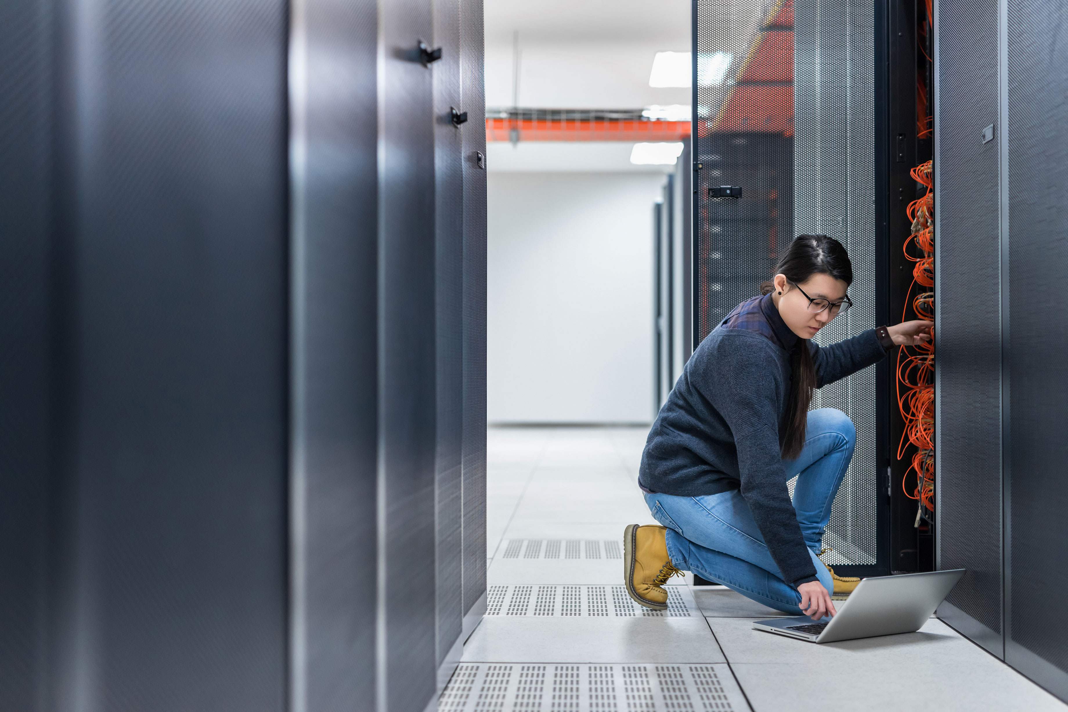 Asian_Female_Technician_Working_on_Server
