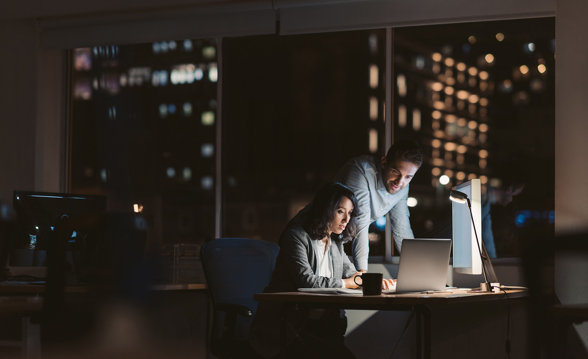 Two Business People Working In The Evening
