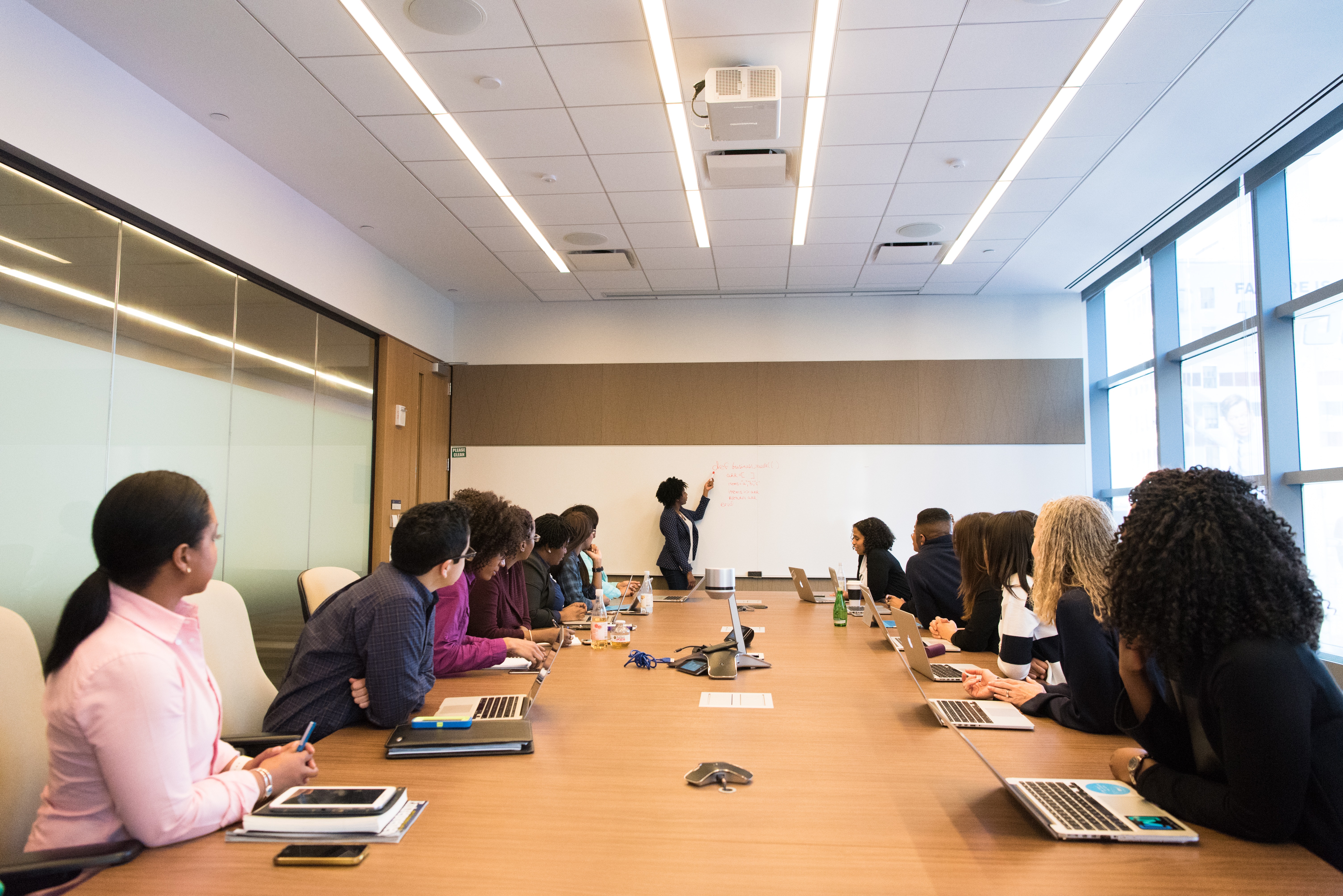 A group of employees attending a training session in a conference room