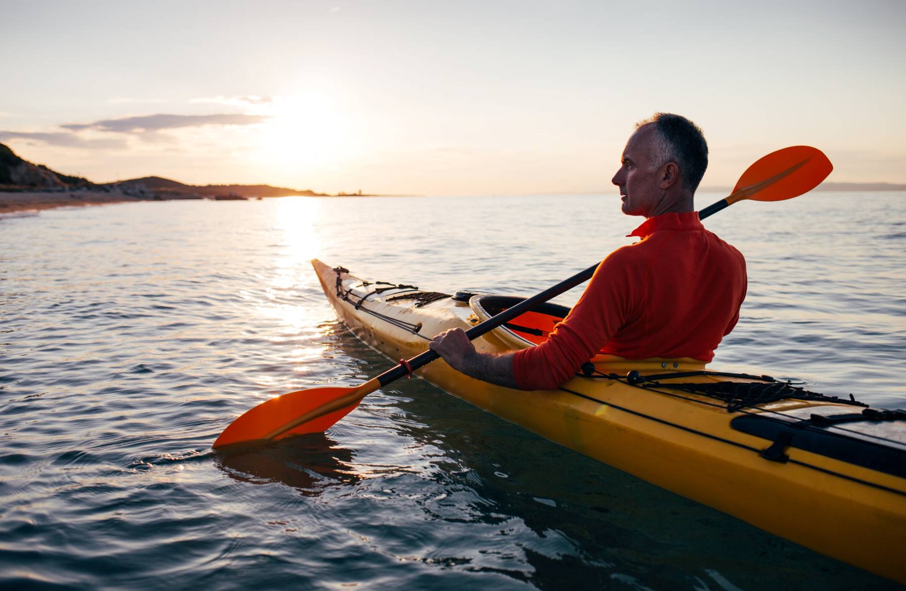 Kayak On Sunset Sea