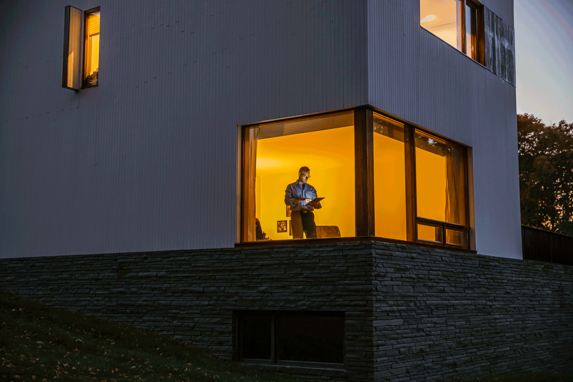 Businessman In Window At Home